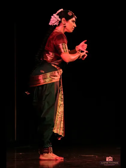A side profile showing the clear lines and posture maintained throughout a performance. This discipline is the foundation upon which expressive dance is built.