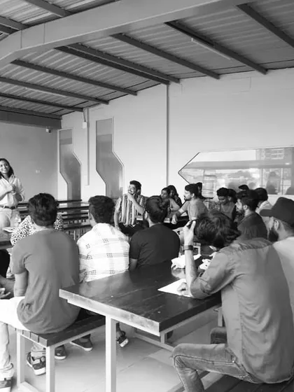 A candid shot from a workshop with adults. These sessions often involve breaking down the barriers of what we think storytelling is, exploring everything from humor to bizarre human emotions.