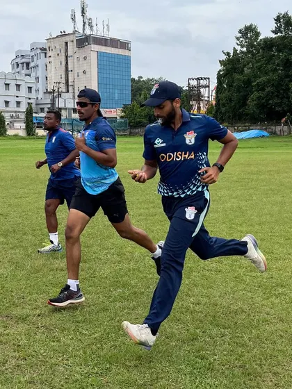 Running alongside my athletes during a drill. I believe in leading by example and being present in the trenches with them.