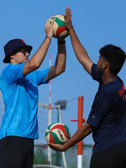 Another example of hands-on coaching, ensuring the player's form is perfect from the very beginning.