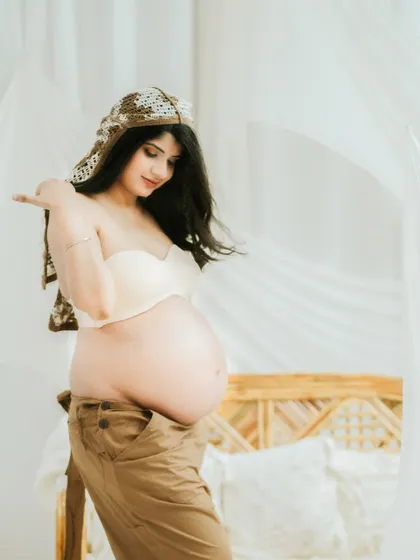A candid, in-motion shot that feels natural and free. This captures the mother's personality and the dynamic energy of this life stage.