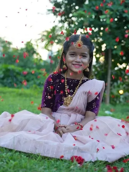 Living in a fairytale moment. This shot captures the magic of a custom outfit, with a rich purple velvet blouse and a dreamy light pink lehenga. I love creating pieces that make your kids feel as special as they are.