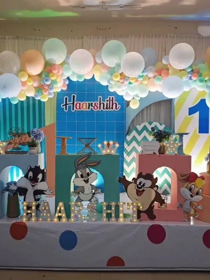 That's all folks! A fun and colourful Looney Tunes theme for Haarshith's first birthday. We brought Bugs Bunny, Taz, and the whole gang together with a pastel balloon arch and character cutouts for a classic cartoon celebration.