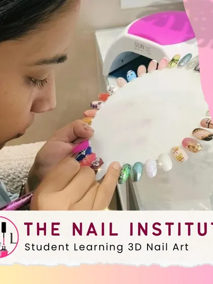 This student is learning 3D nail art, practicing how to create raised designs and apply embellishments for a dramatic effect.