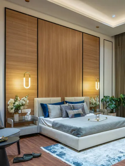 A duplicate of image 44, this wide shot provides another look at the grand master bedroom with its full-height wood paneling, showcasing the scale and sophistication of the design.
