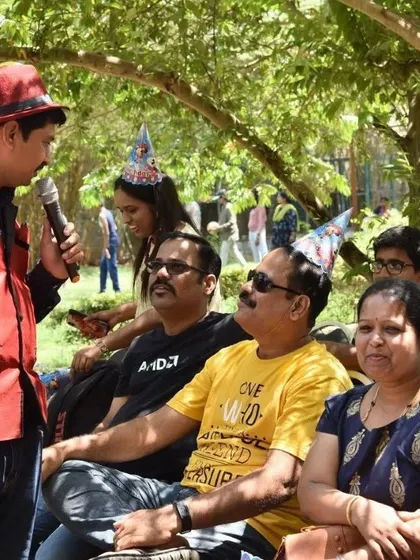 Engaging with a seated audience during an outdoor event. Even when guests are relaxing, I make sure to keep them entertained and part of the show.
