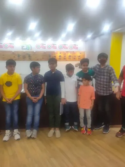 Here are all the young guests from Krishiv's party lined up for a group picture. After a fun session of learning to handle air rifles and pistols, they were all proud of their new skills.