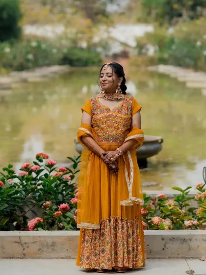 A portrait of the bride during her Mehendi ceremony, set against a beautiful garden backdrop. I ensure there are plenty of beautiful spots for photography throughout the event.