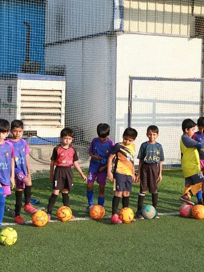 Our grassroots program starts with the basics. A group of our youngest players lines up for a drill, learning fundamental ball skills in a fun and structured environment.