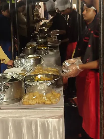 Our live chaat counters are a highlight at any event, offering fresh, interactive food experiences. Here, our team is busy serving guests at a large annual day celebration for The Oberoi, Bangalore.