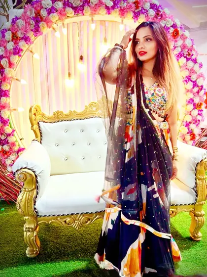 Dressed up for my cousin's wedding sangeet. The waterfall dupatta drape on this printed lehenga is perfect for a performance.