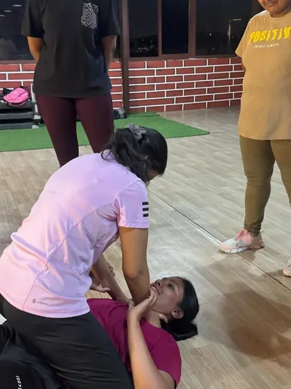A practical demonstration of escaping a pin on the ground. In our workshops, you get to practice these scenarios with partners in a controlled setting, so you are prepared for the reality.