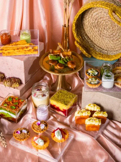 A lavish festive spread featuring a variety of sweet and savory bites. The use of different heights, textures, and a cohesive color palette creates a visually stunning display.