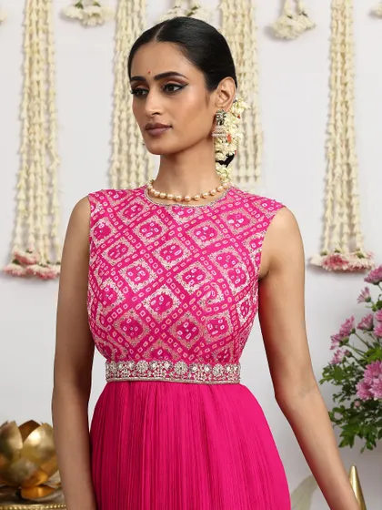 A close-up of the pink Bandhani bodice, showing the intricate embroidery and the flattering neckline.