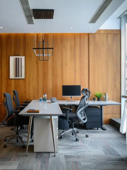 Warmth and sophistication were the goals for this executive cabin. I used rich wood paneling to create a cozy yet professional atmosphere. The clean lines of the desk and ergonomic chairs ensure it's a comfortable and productive space for long workdays.