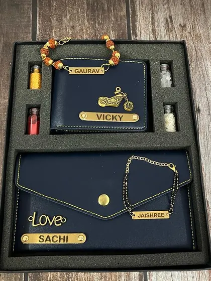 Here is the Bhai-Bhabhi wallet and clutch set in a deep blue, with custom charms like a bike for him and a "Love" tag for her.