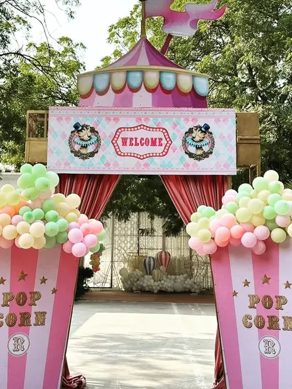 A straight-on view of the welcoming carnival entrance, inviting guests into Ranya's first birthday celebration.
