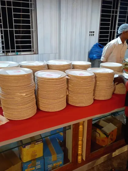 Plates and branded napkins stacked and ready for guests at SSR Function Hall. We manage all the small details so you don't have to worry about a thing during your event.