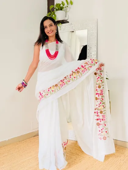 This white khadi cotton saree with a colorful embroidered border is so pretty. It's a simple saree that is elevated by the beautiful handwork. A great find from Meesho for under 500.