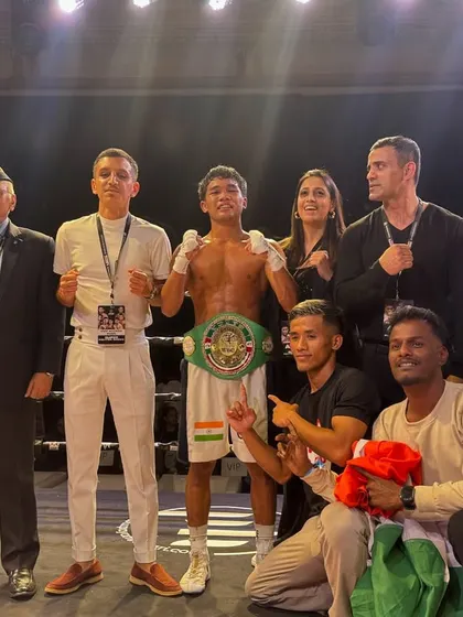 The champion and his team. It takes a village to build a champion.