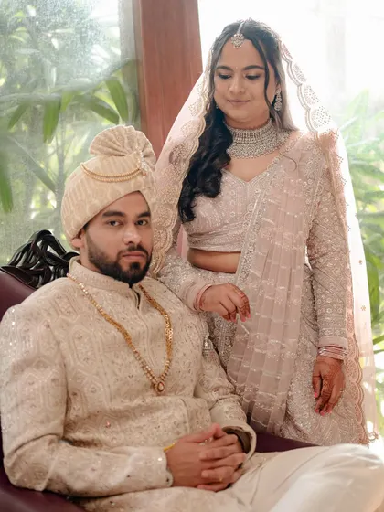 A regal portrait of the couple. The bride's soft and flowy hairstyle and glowing makeup create a romantic and timeless image.