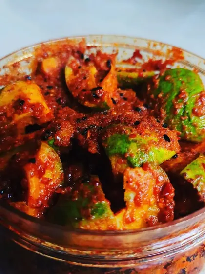 Another perspective on my fresh Mango Pickle, highlighting the vibrant green of the mango skin against the rich red of the spices.