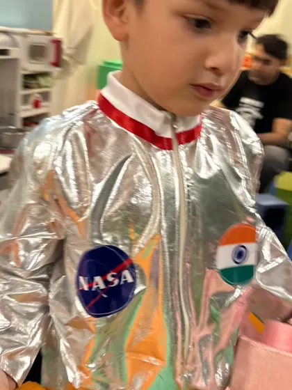 This little astronaut in a silver NASA suit with an Indian flag patch is on a mission for fun.