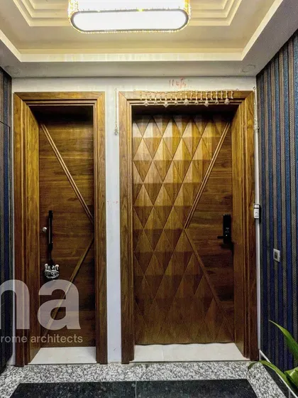 Can you spot the hidden shaft door? We love to seamlessly integrate functional necessities into our designs. Here, a fluted panel conceals a door, matching the aesthetic of the main entrance.