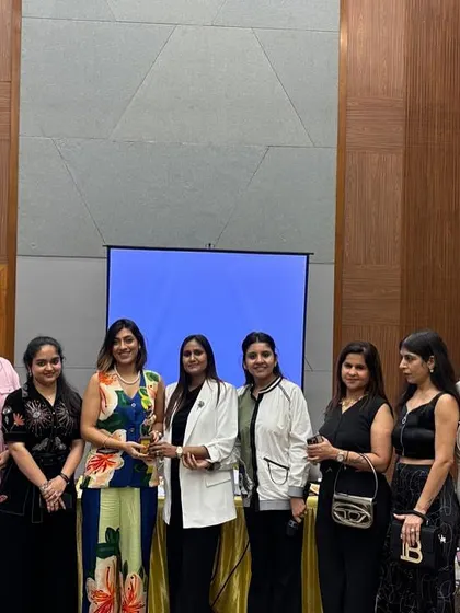 Posing with a group of participants after a successful session. Seeing these women leave with renewed confidence is the best part of my job.