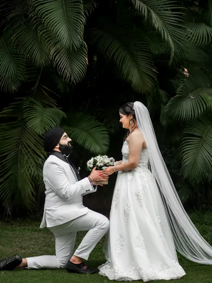 The perfect proposal pose, captured during a post-ceremony shoot with the couple in their wedding attire.