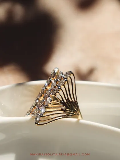 This fan-like open ring is one of my most popular modern designs. The delicate gold wires are tipped with sparkling diamonds, creating a look that is both airy and glamorous.