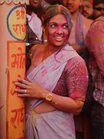 A vibrant collection of images from the Holi celebrations in Braj, specifically Nandgaon. This series captures the pure ecstasy of the festival, with portraits of devotees, men dressed as gopis, and crowds dancing in a cloud of colors.