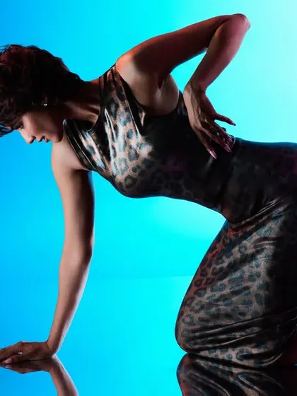 Another reflection shot, this time with a more dynamic, athletic pose.