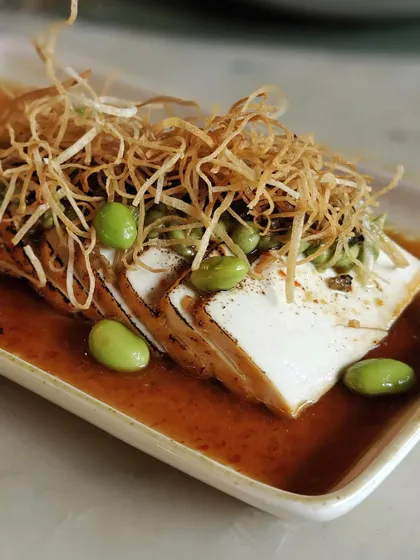 Our Tofu Carpaccio, a high-protein, low-carb option that doesn't compromise on flavor or texture.
