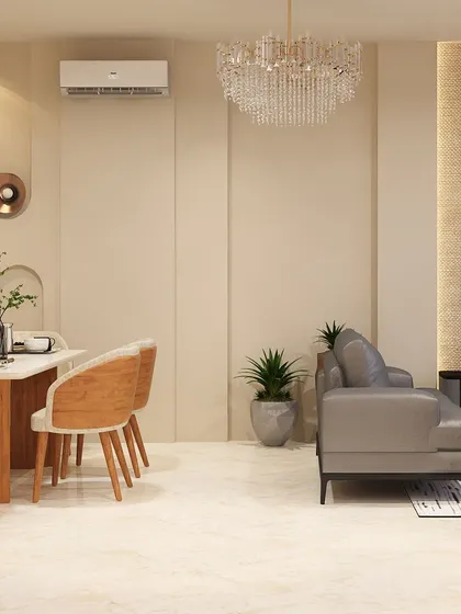 An open-concept living and dining space designed for Tata Primanti. The consistent neutral palette, marble flooring, and elegant furniture create a seamless flow between the two functional areas.
