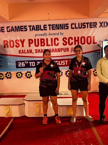 Our players on the podium at the CBSE Cluster Table Tennis Championship. Suhani Agarwal and another teammate celebrate their victory in the U-17 Girls event, a result of their excellent teamwork and individual skill.