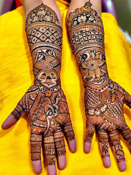 This design features a unique combination of peacock and elephant-head motifs, creating a very artistic look.