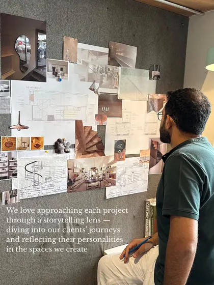 We approach every project through a storytelling lens. Here, Sid is reviewing a mood board, a critical part of our process where we dive into our clients' journeys to reflect their personalities in the spaces we create.
