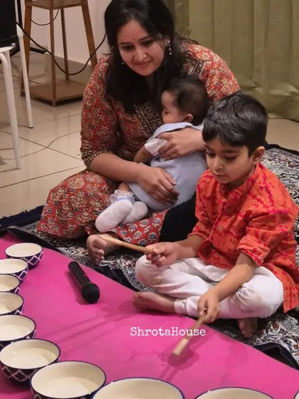 A mother and her children creating music and memories together during our Jaltarang camp. We design our workshops not as drop-off classes, but as shared spaces where families can bond over the delightful sounds of Indian music.
