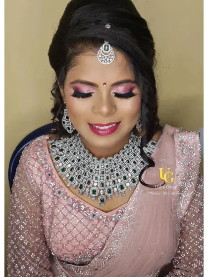 Another beautiful close-up of Shruthi's reception makeup, highlighting the flawless skin finish and vibrant lip color.