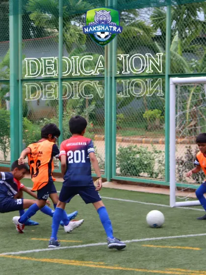 Dedication on display. Young players battle for the ball during a practice match, showing the competitive spirit we foster.