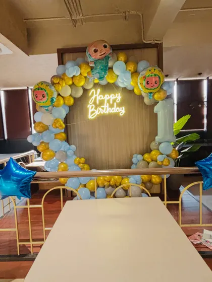 A full view of the Cocomelon birthday setup in a restaurant, showing how I can decorate any space.