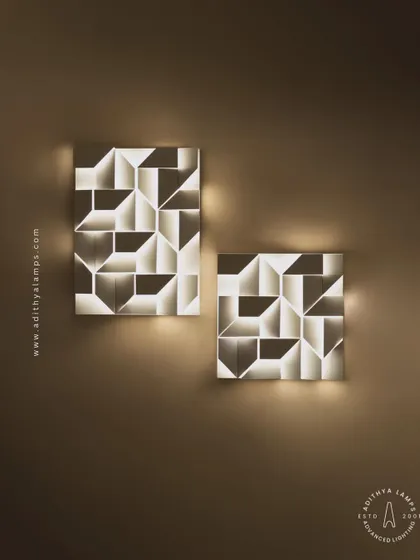 This 3D geometric wall light plays with light and shadow. The puzzle-like arrangement of white panels creates pockets of light, turning a simple wall into a dynamic feature. It is a perfect piece of illuminated wall art.