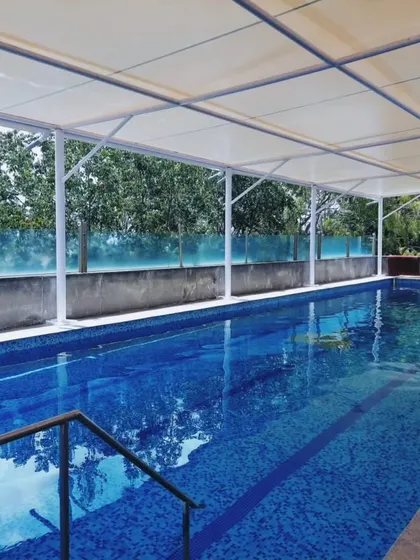 Another look at our newly covered and temperature-controlled pool in Malleshwaram. The clear roof lets in natural light while protecting you from the elements.
