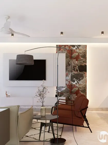 You don't need to fill a room with things just because you hired a designer. Here, we let a 10 sq ft panel of striking marble be the star. The rest of the TV unit and living area is designed to be simple and clean, accentuating the feature rather than competing with it.