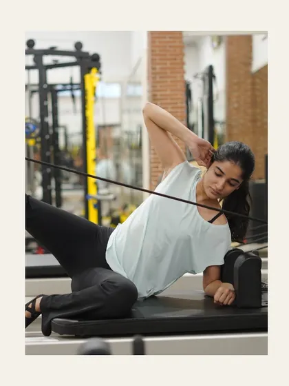 Side-lying leg work with the straps is perfect for targeting the outer thighs and obliques.