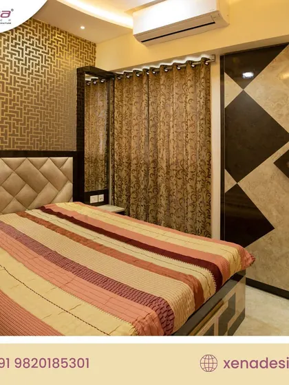 A bedroom with a bold, geometric-patterned wallpaper and a matching wardrobe design. The tufted headboard adds a soft, luxurious touch.