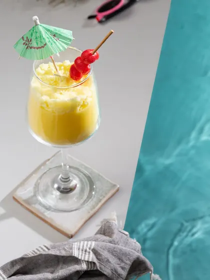 Time for a poolside drink? This Pina Colada gel candle looks just like the frosty cocktail, complete with a little umbrella and cherries.