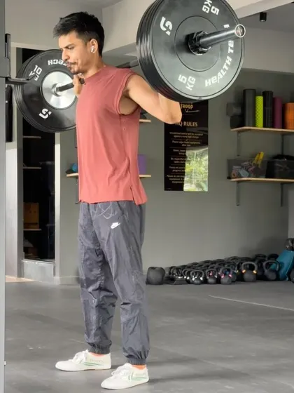 A photo of me doing back squats. Barbell work is an important part of a well-rounded strength program.