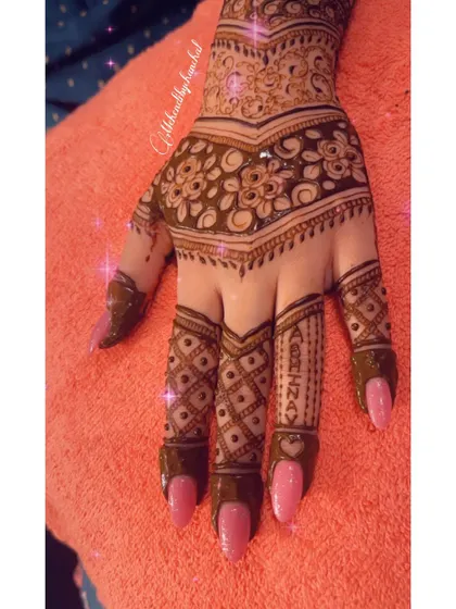 A close-up of the hand from the engagement set, showing the detailed finger work.
